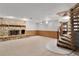 Spacious basement featuring a stone fireplace and unique spiral staircase at 5581 Sw 197Th Ter, Dunnellon, FL 34431