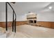 Large basement with wood-burning stone fireplace and stairs to the upper level at 5581 Sw 197Th Ter, Dunnellon, FL 34431