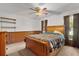 Bedroom with natural light, ceiling fan and shelving at 5581 Sw 197Th Ter, Dunnellon, FL 34431