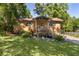 Charming brick home with a well-maintained lawn and inviting front porch, perfect for enjoying the outdoors at 5581 Sw 197Th Ter, Dunnellon, FL 34431
