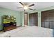 Spacious main bedroom with a ceiling fan, windows, and good storage at 5581 Sw 197Th Ter, Dunnellon, FL 34431