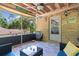 View of the screened porch with wood ceiling and room to relax and have fun at 5581 Sw 197Th Ter, Dunnellon, FL 34431