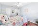 Cozy bedroom with a ceiling fan and beach themed decor at 612 Lisbon Ln, The Villages, FL 32159