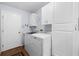 Laundry room with modern appliances and ample storage at 612 Lisbon Ln, The Villages, FL 32159