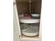 Kitchen cabinet has Lazy Susan storage with round containers at 612 Lisbon Ln, The Villages, FL 32159