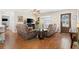 Comfortable living room with hardwood floors, neutral walls, and plenty of natural light at 612 Lisbon Ln, The Villages, FL 32159