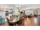 Bright living space with dining area, breakfast bar, and open access to the living room at 612 Lisbon Ln, The Villages, FL 32159