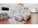 Spacious main bedroom features a king-size bed, soft rug, and modern decor at 612 Lisbon Ln, The Villages, FL 32159