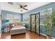 Cozy sunroom with a ceiling fan and several windows for ample natural light at 612 Lisbon Ln, The Villages, FL 32159