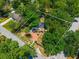 Beautiful home nestled among mature trees, featuring a brick driveway and a well-maintained yard at 640 Sailfish Rd, Winter Springs, FL 32708