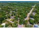 Aerial view showcasing a property with lush green surroundings in a serene and established neighborhood setting at 640 Sailfish Rd, Winter Springs, FL 32708