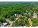 Aerial view featuring a charming single-Gathering home nestled within a lush, tree-filled neighborhood at 640 Sailfish Rd, Winter Springs, FL 32708