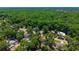 Aerial view capturing a home in a neighborhood surrounded by lush greenery, showcasing the community's serene environment at 640 Sailfish Rd, Winter Springs, FL 32708