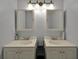 Well-lit bathroom featuring double sink vanity at 640 Sailfish Rd, Winter Springs, FL 32708