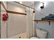 Modern bathroom featuring tiled shower with curtain and convenient toilet at 640 Sailfish Rd, Winter Springs, FL 32708