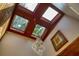 Unique skylight ceiling fixture with chandelier and stained glass at 640 Sailfish Rd, Winter Springs, FL 32708