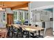 Bright dining area featuring a wooden table, black chairs, and view to living space at 640 Sailfish Rd, Winter Springs, FL 32708