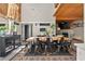 Bright dining room boasts a stylish chandelier, high ceilings, and a large wooden dining table at 640 Sailfish Rd, Winter Springs, FL 32708