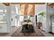 Open floorplan dining room highlighting a large table and modern design elements at 640 Sailfish Rd, Winter Springs, FL 32708