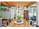 Elegant dining room featuring a wood ceiling, decorative lighting, and views of the outside at 640 Sailfish Rd, Winter Springs, FL 32708
