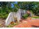 Exterior detail featuring textured walls and lush landscaping at 640 Sailfish Rd, Winter Springs, FL 32708