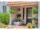 Inviting front entrance featuring a blue door, decorative plants, and a charming brick walkway at 640 Sailfish Rd, Winter Springs, FL 32708