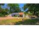 Single story home with mature landscaping and brick driveway at 640 Sailfish Rd, Winter Springs, FL 32708