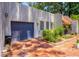 Beautiful home features a blue garage door and terracotta colored roof at 640 Sailfish Rd, Winter Springs, FL 32708