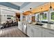 Open concept kitchen and dining area offers bright natural light and eat-in kitchen island at 640 Sailfish Rd, Winter Springs, FL 32708