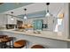 Modern kitchen with white cabinets, stainless steel appliances, and a unique blue refrigerator at 640 Sailfish Rd, Winter Springs, FL 32708