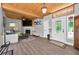 Inviting living room with wood ceiling, fireplace, hardwood floors, and ample natural light at 640 Sailfish Rd, Winter Springs, FL 32708