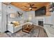 Cozy living room featuring a fireplace, wood ceiling, and stylish decor, ideal for relaxation at 640 Sailfish Rd, Winter Springs, FL 32708