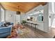 Open-concept living area with wood ceilings and a view to the kitchen at 640 Sailfish Rd, Winter Springs, FL 32708
