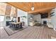 Spacious layout with wood ceiling encompassing the dining area and cozy living room with a fireplace at 640 Sailfish Rd, Winter Springs, FL 32708