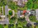 Aerial view of the property highlighting its lush landscaping and circular driveway at 647 E 3Rd Ave, Mount Dora, FL 32757