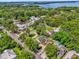 A peaceful neighborhood is showcased, with the property and a nearby lake visible at 647 E 3Rd Ave, Mount Dora, FL 32757