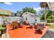 Outdoor patio with seating and string lights, perfect for entertaining at 647 E 3Rd Ave, Mount Dora, FL 32757