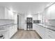This well designed kitchen features stainless steel appliances, and beautiful countertop at 647 E 3Rd Ave, Mount Dora, FL 32757