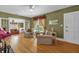 Inviting living room featuring french doors, hardwood floors, and comfortable seating at 647 E 3Rd Ave, Mount Dora, FL 32757