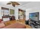 Comfortable sitting room with hardwood floors leading to the main living room and natural light at 647 E 3Rd Ave, Mount Dora, FL 32757