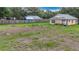 View of backyard with fencing, green grass and a shed at 6710 Winkles St, Coleman, FL 33521