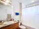 Bathroom with sink, granite countertop, and white shower curtain at 6710 Winkles St, Coleman, FL 33521