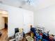 Bedroom with hardwood floors, ceiling fan, and door at 6710 Winkles St, Coleman, FL 33521