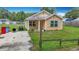Charming single-story home featuring a quaint front porch and tidy landscaping on a sunny day at 6710 Winkles St, Coleman, FL 33521