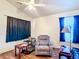 Bright living room features hardwood floors, a comfortable chair, and plenty of natural light streaming through the windows at 6710 Winkles St, Coleman, FL 33521