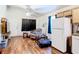 Efficient living space adjacent to kitchen with appliances and hardwood floors at 6710 Winkles St, Coleman, FL 33521