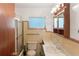 Classic bathroom with a shower, toilet, and vanity at 7378 Ne 49Th Ln, Wildwood, FL 34785