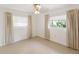 Bright bedroom with two windows offering natural light at 7378 Ne 49Th Ln, Wildwood, FL 34785