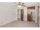 Bedroom featuring tile flooring and closet space at 7378 Ne 49Th Ln, Wildwood, FL 34785