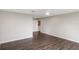Bright bedroom features wood-look flooring and neutral paint at 7378 Ne 49Th Ln, Wildwood, FL 34785